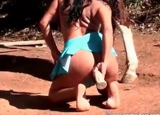 Big-ass slut fucks with a very massive dildo in front a stallion